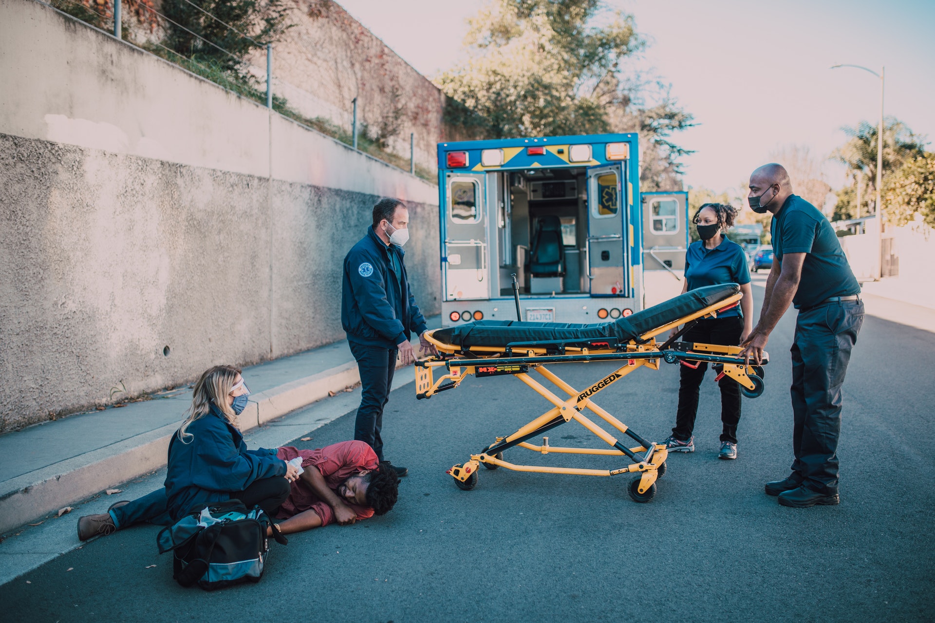 Injured man being tended to by paramedics