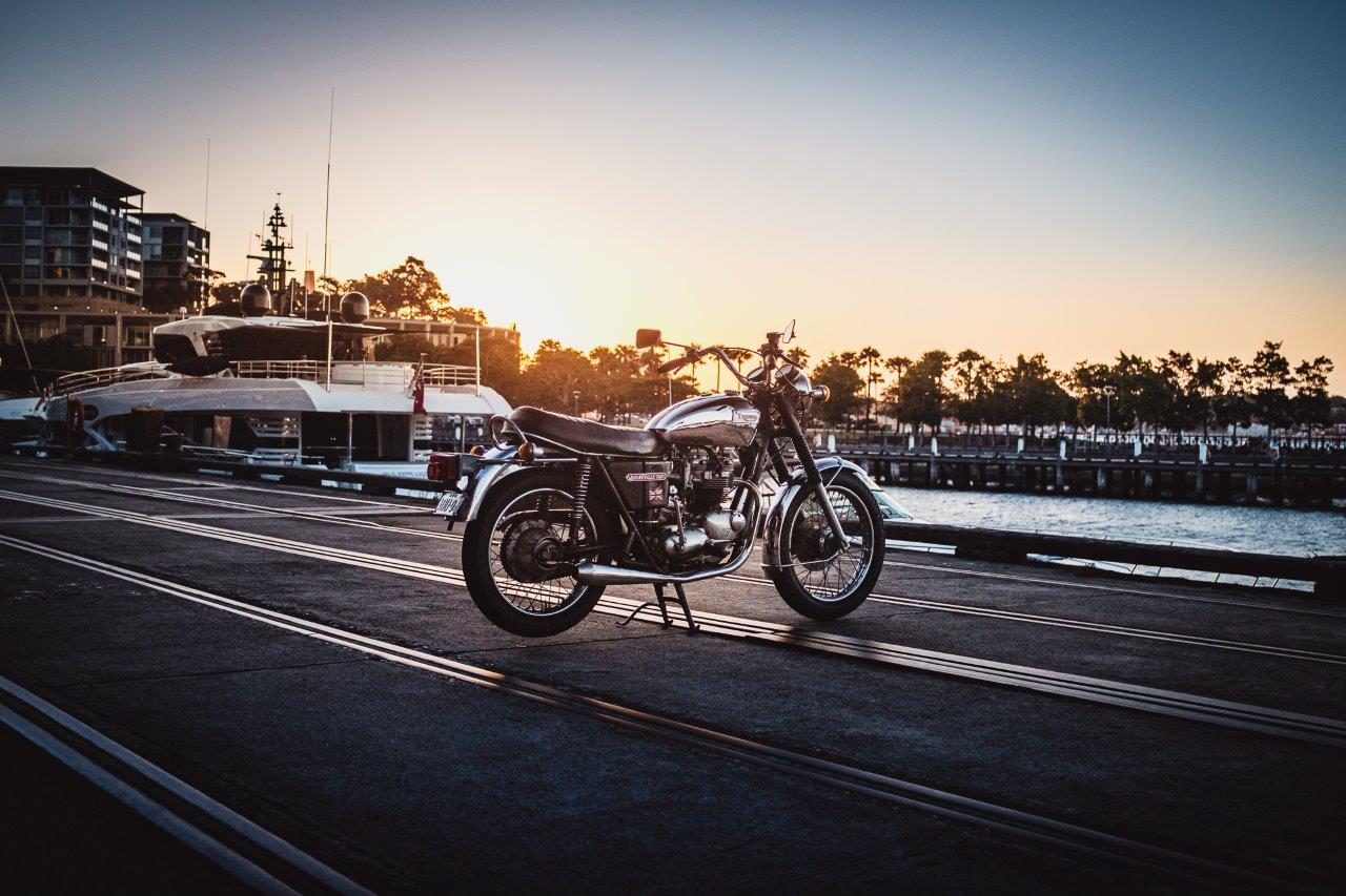 1973 Triumph Bonneville T140V on wharf at sunset