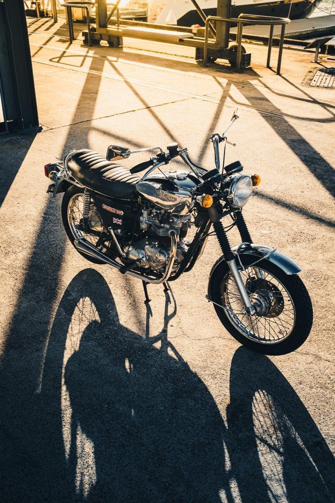 1973 Triumph Bonneville T140V with afternoon sun and shadows