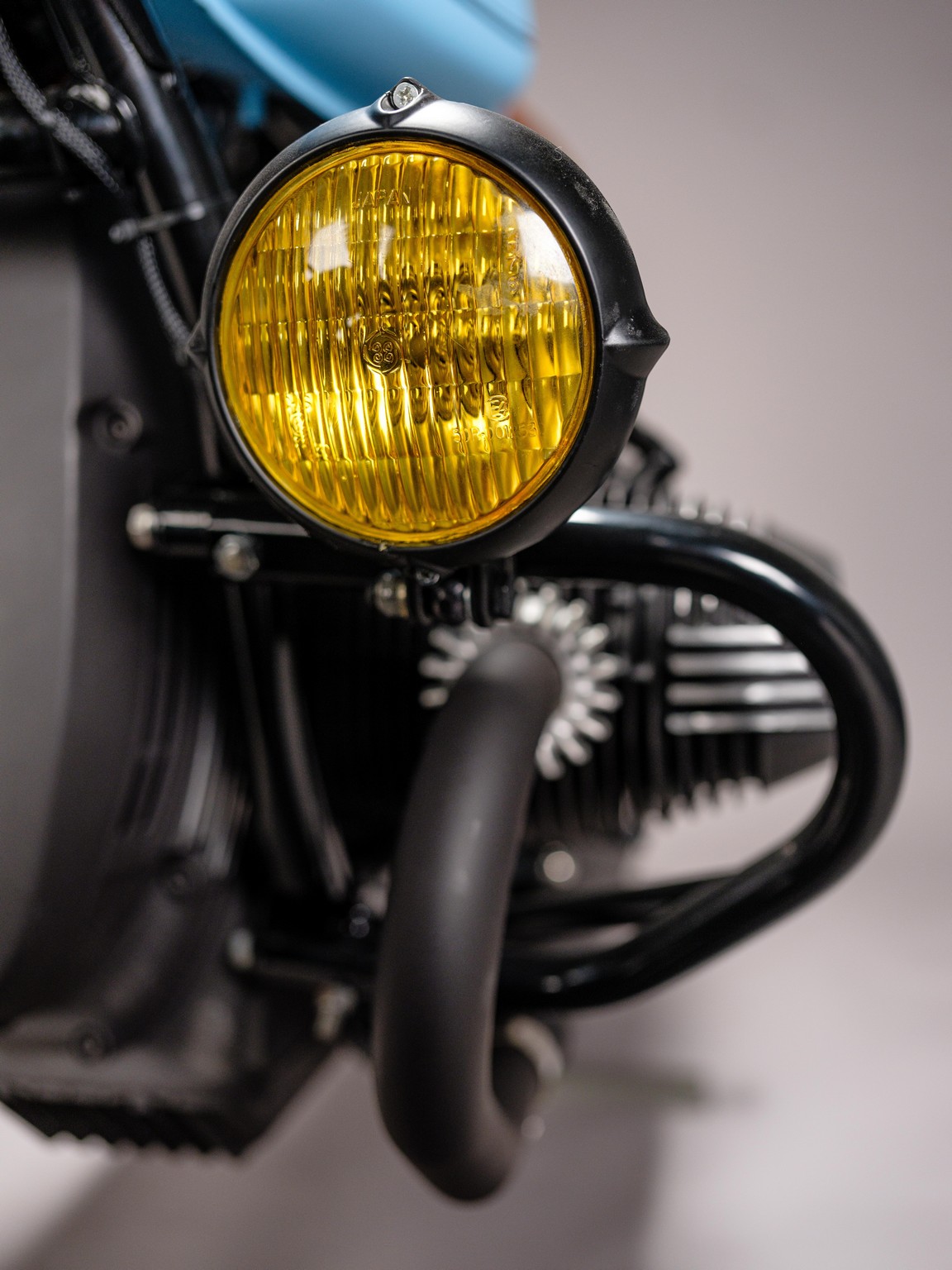 Spotlight detail for custom 1982 BMW R65 Scrambler from AMP Motorcycles in Germany