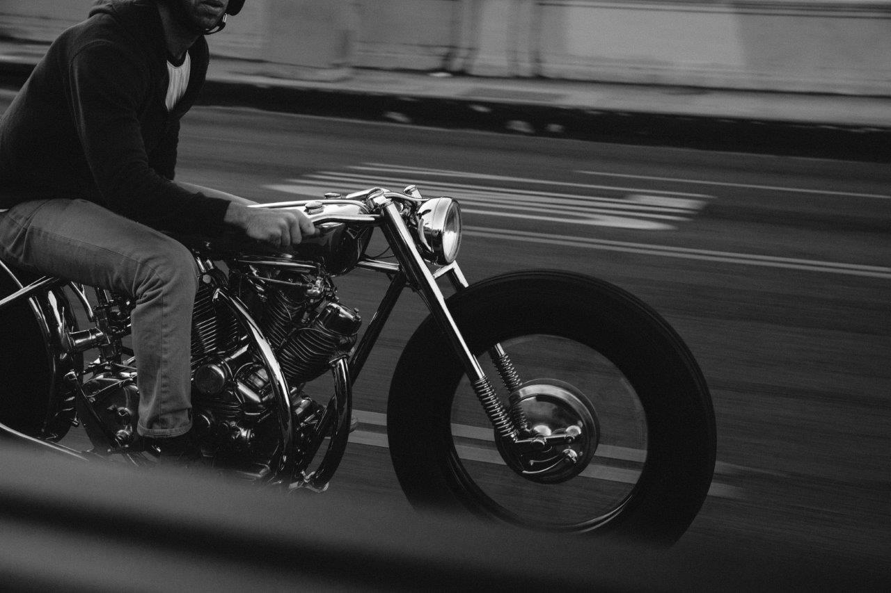 Max Hazan rides one of his custom motorcycles on an LA freeway