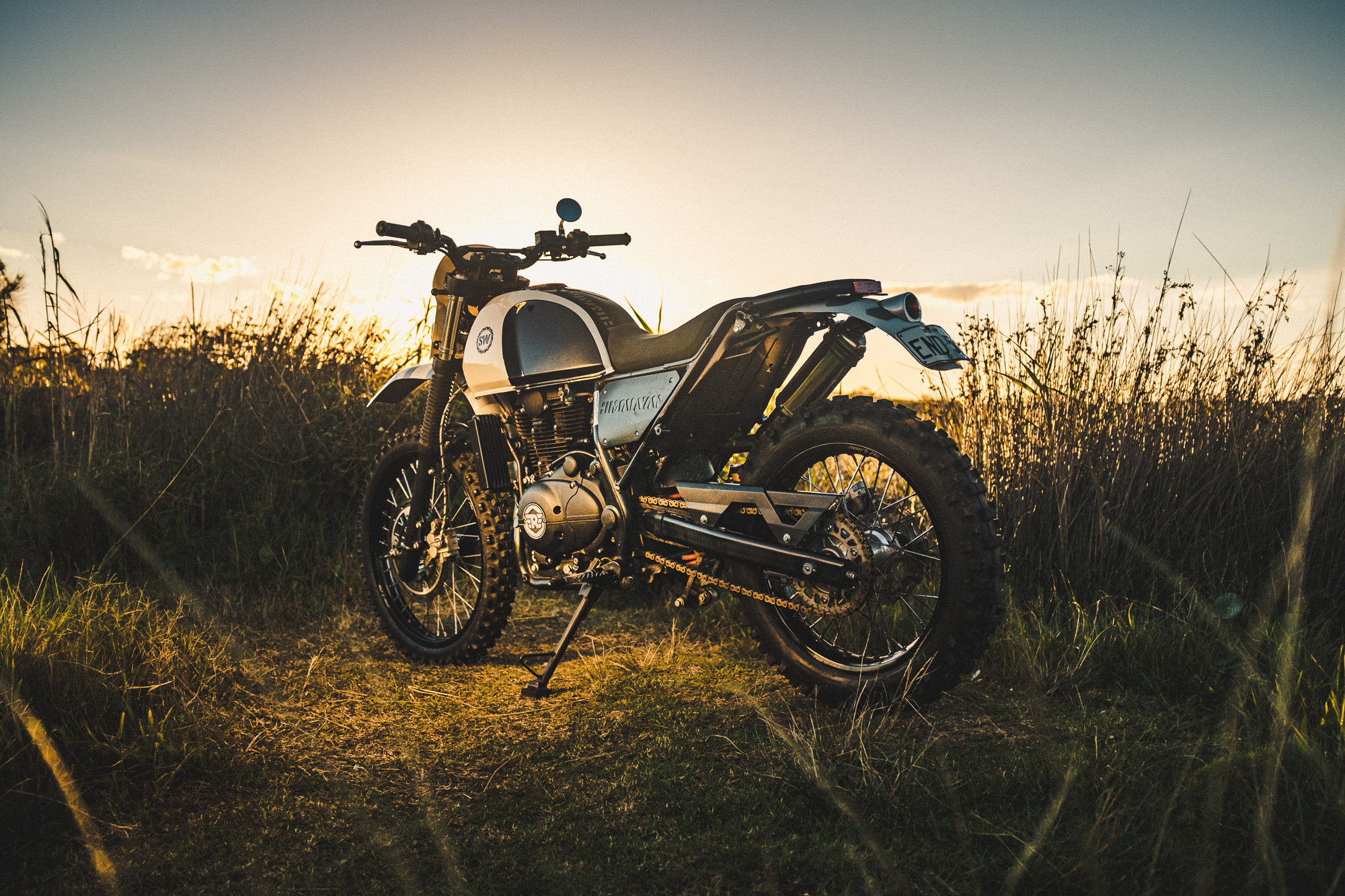 Schlachtwerk's Royal Enfield Himalayan Enduro Custom on a beach at sunset in Sydney