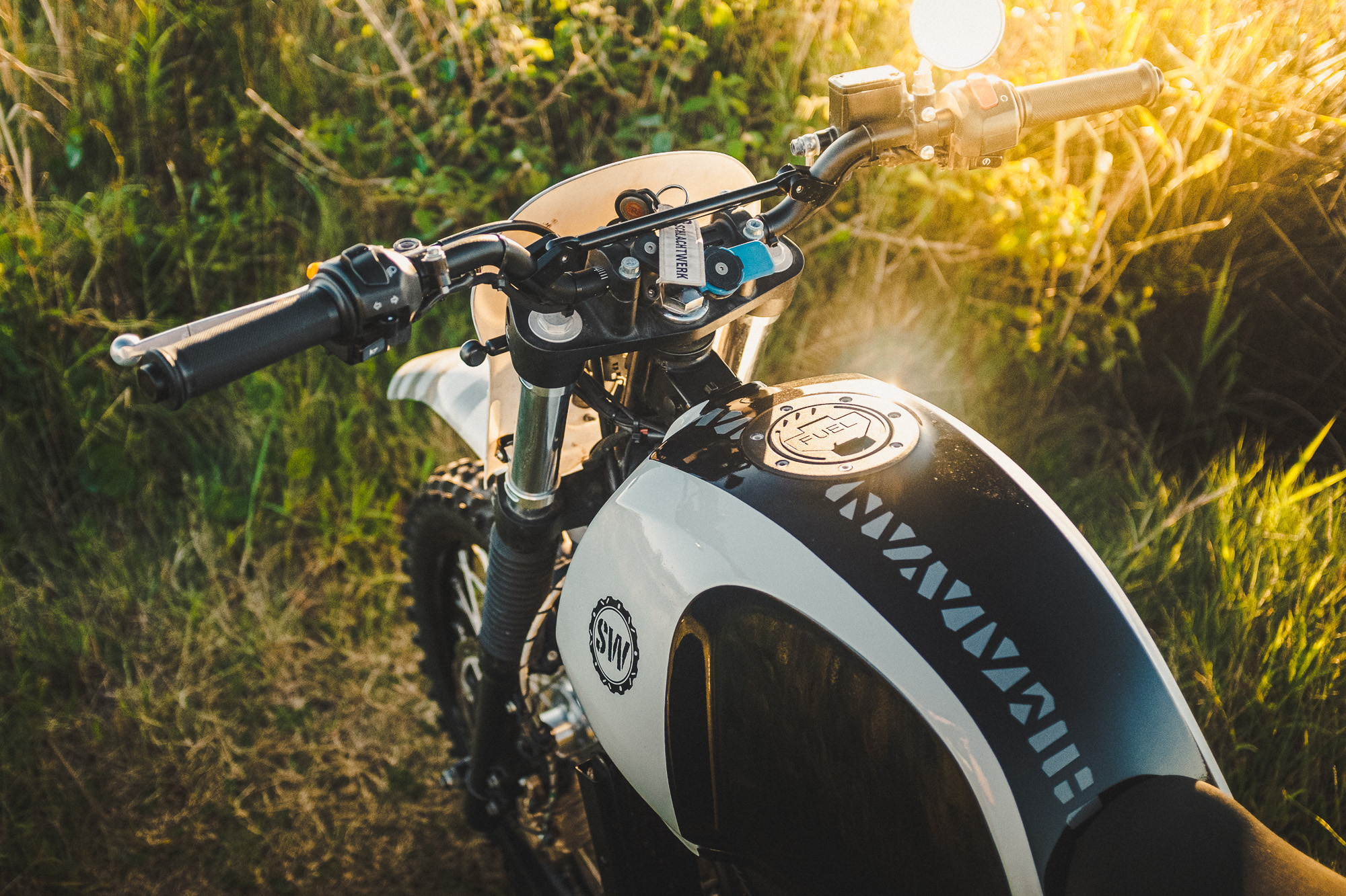 Schlachtwerk's Royal Enfield Himalayan Enduro Custom on a beach at sunset in Sydney