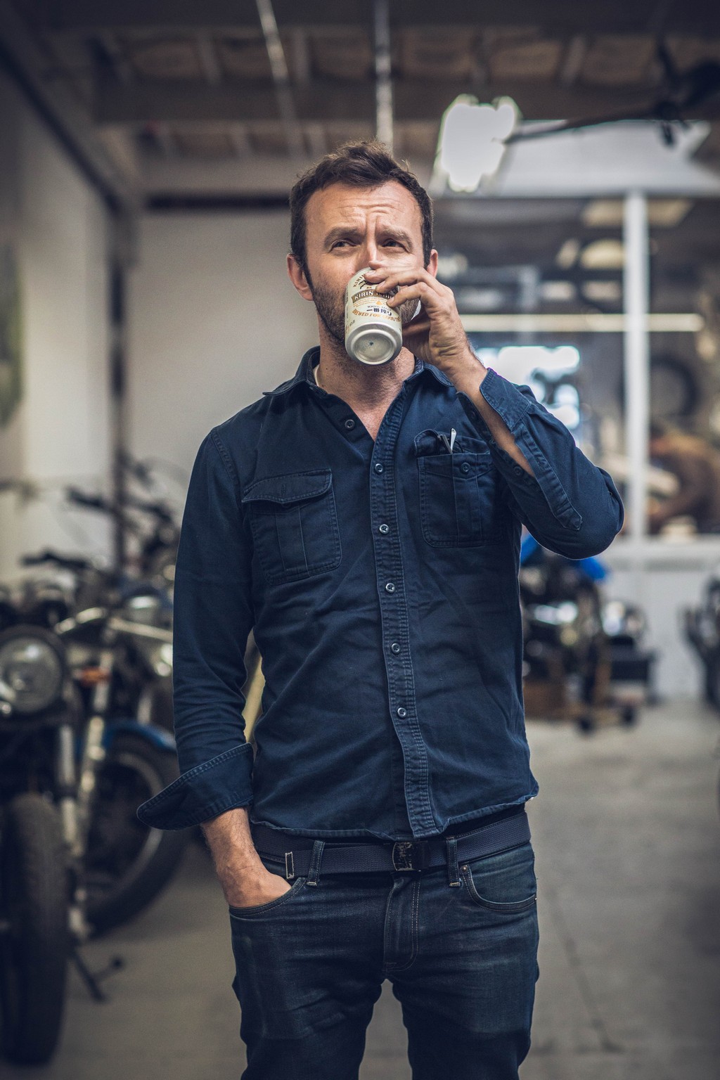 Hugo Eccles from San Francisco's Untitled Motorcycles with a beer