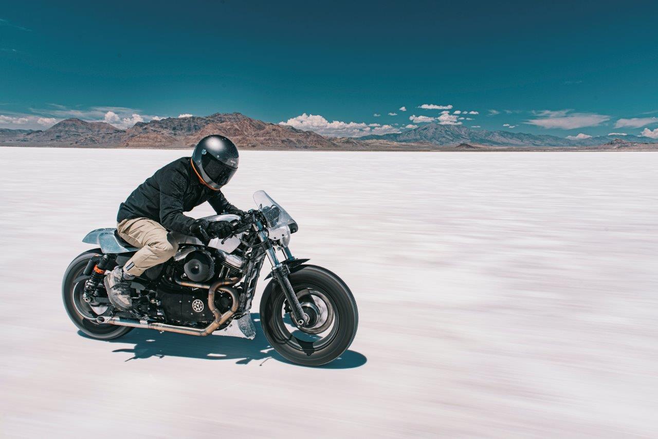 David Chang from Cafe Racers of Instagram on a Harley motorcycle riding on a salt flat