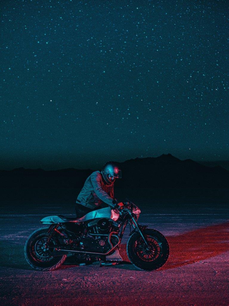  David Chang from Cafe Racers of Instagram on a Harley motorcycle riding on a salt flat at night