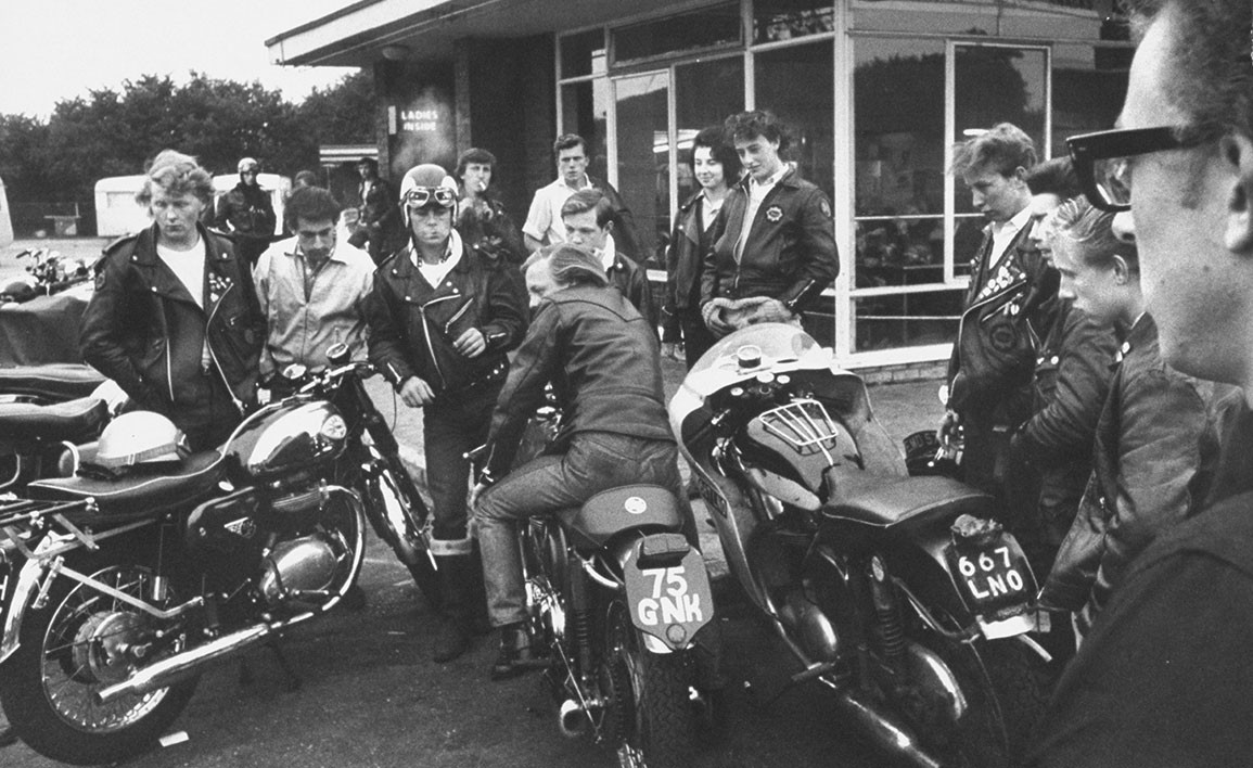 A group of original cafe racers in a British cafe car park circa 1960