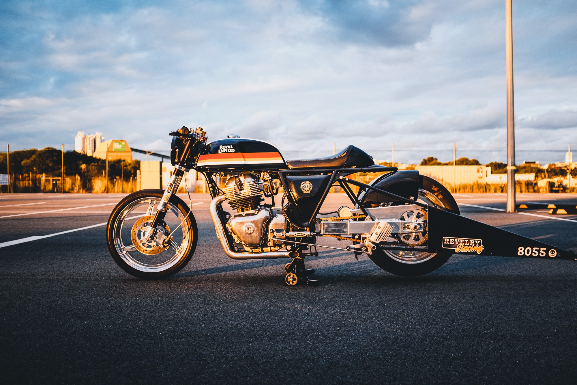 A Royal Enfield 650 Twin drag bike in a Sydney car park at sunset