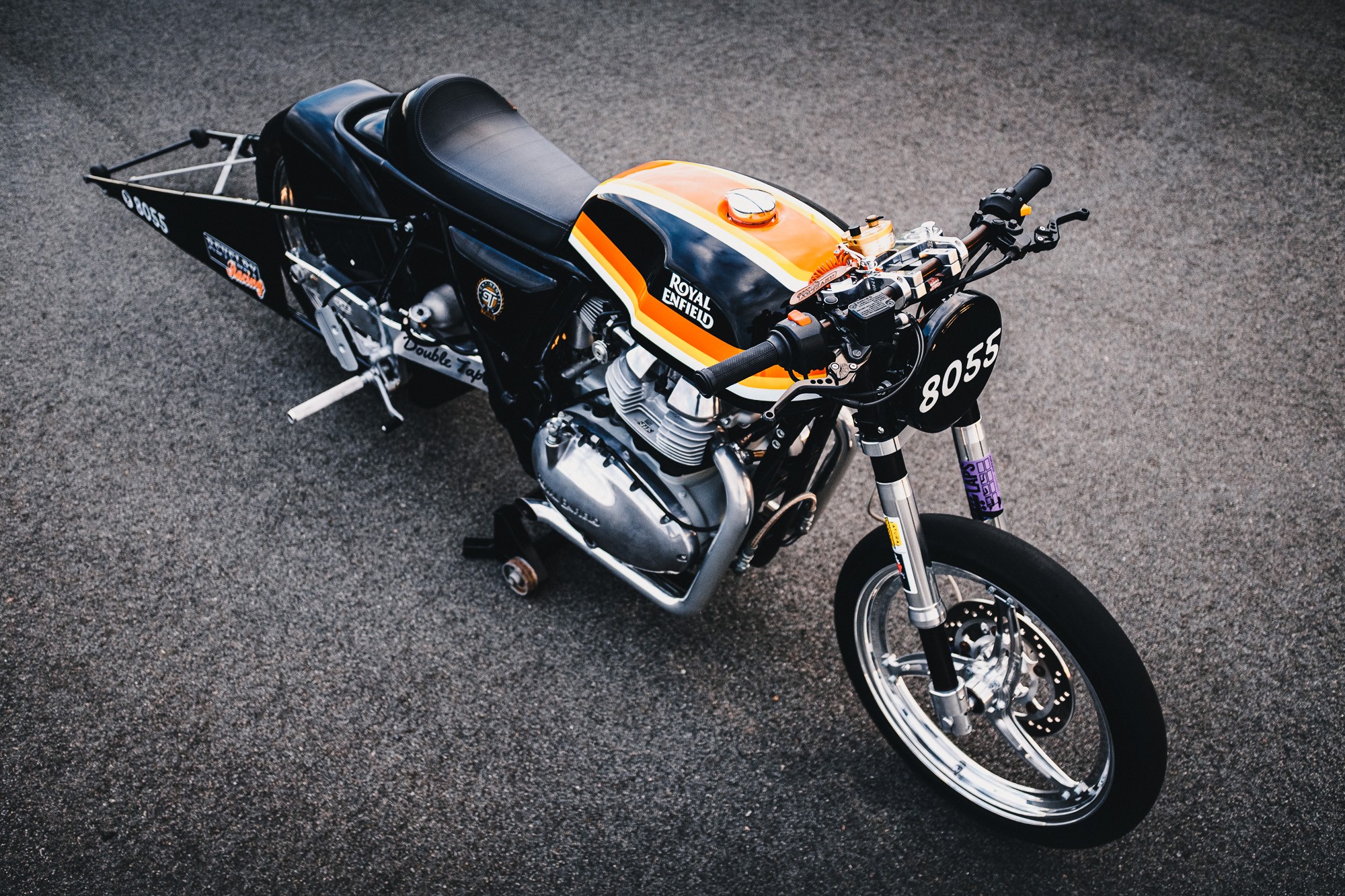 A Royal Enfield 650 Twin drag bike in a Sydney car park at sunset