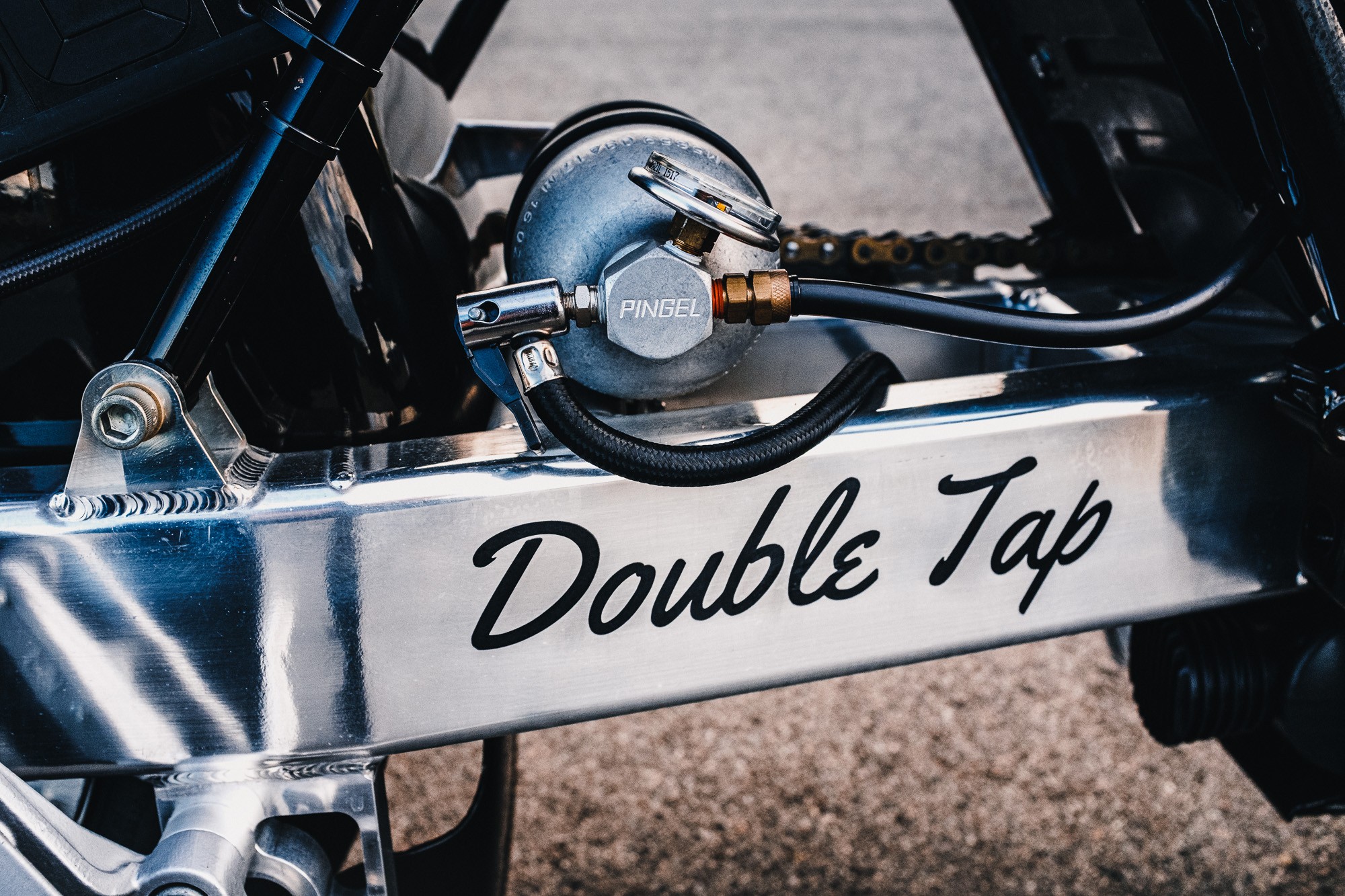 A shot of the air shifter tank on a Royal Enfield 650 Twin drag bike in a Sydney car park at sunset