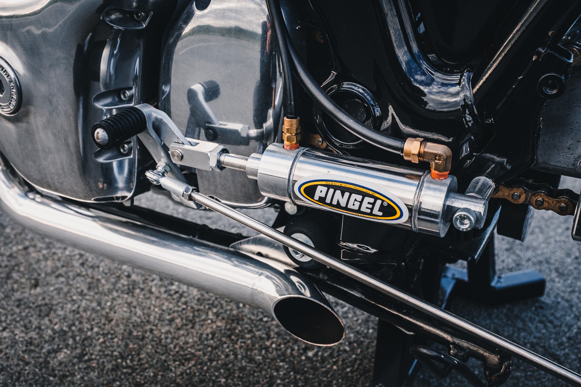 A shot of the air shifter tank on a Royal Enfield 650 Twin drag bike in a Sydney car park at sunset