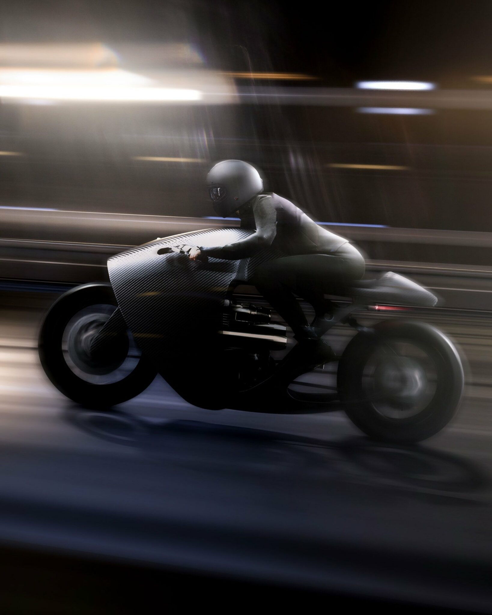 Rider speeding down road on Bandit 9 Supermarine Custom Racer motorcycle