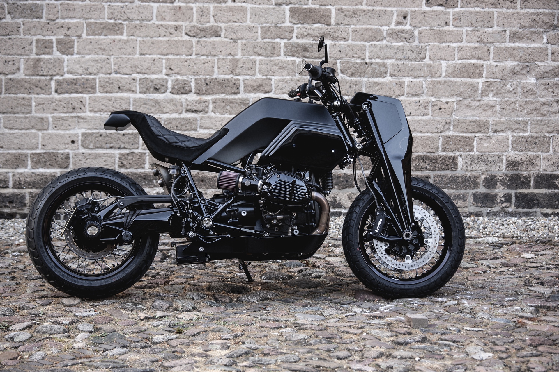 Moto Adonis BMW R nineT Girder custom motorcycle in alley in Amsterdam