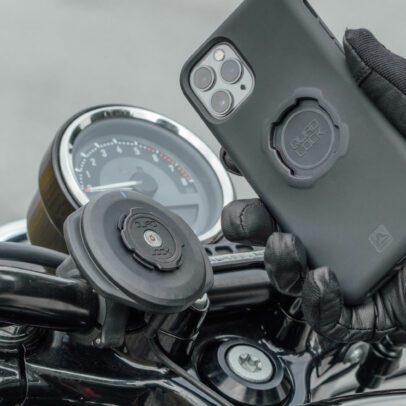 Hand installing phone on the Quadlock motorcycle phone mount
