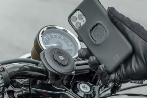 Hand installing phone on the Quadlock motorcycle phone mount