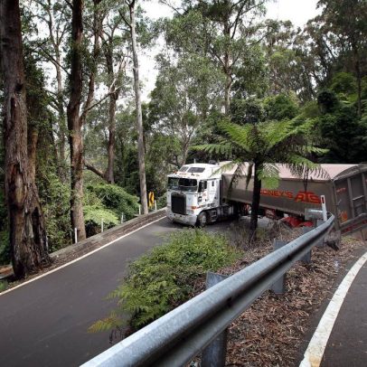 Truck stuck on hairpin bend on Macquarie Pass road in Australia