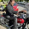 Author sitting on motorcycle while wearing Neowise Jacket by Andromeda Moto