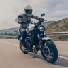 A 2020 Yamaha XSR700 motorcycle rides along a European freeway