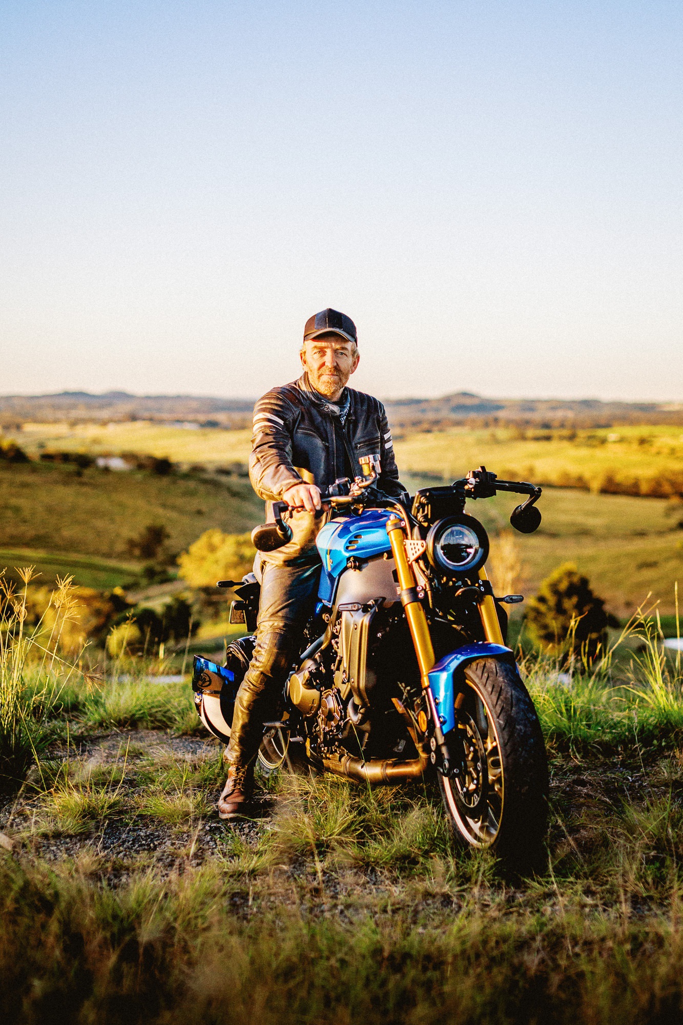 The 2022 Yamaha XSR900 motorcycle and rider at dusk in the outskirts of Sydney, Australia.