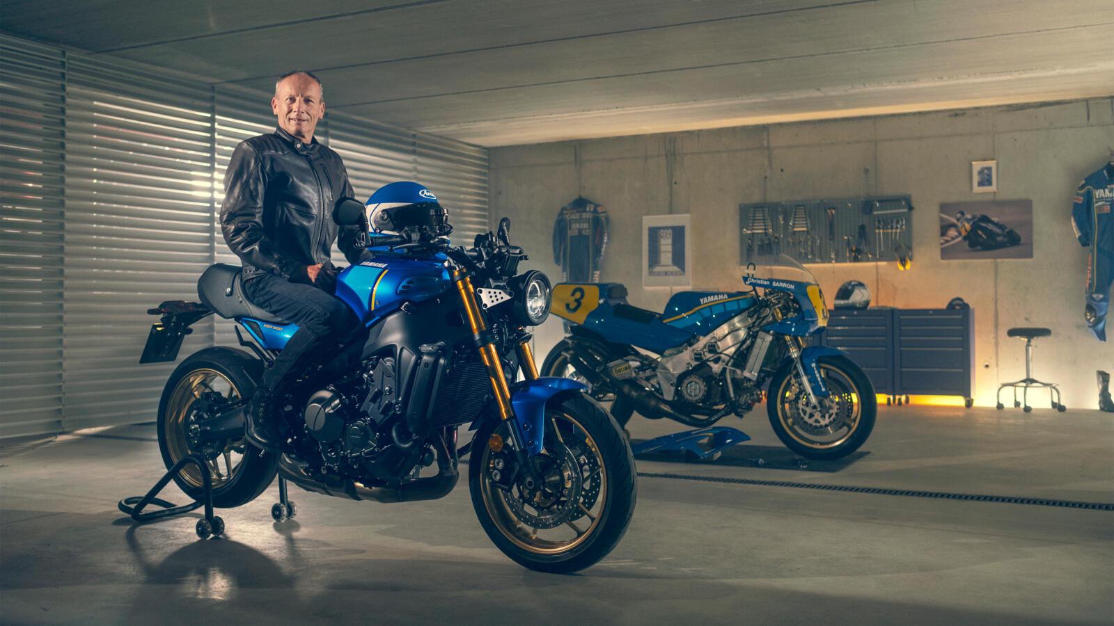 GP racer Christian Sarron and the new 2022 Yamaha XSR900 motorcycle in the workshop