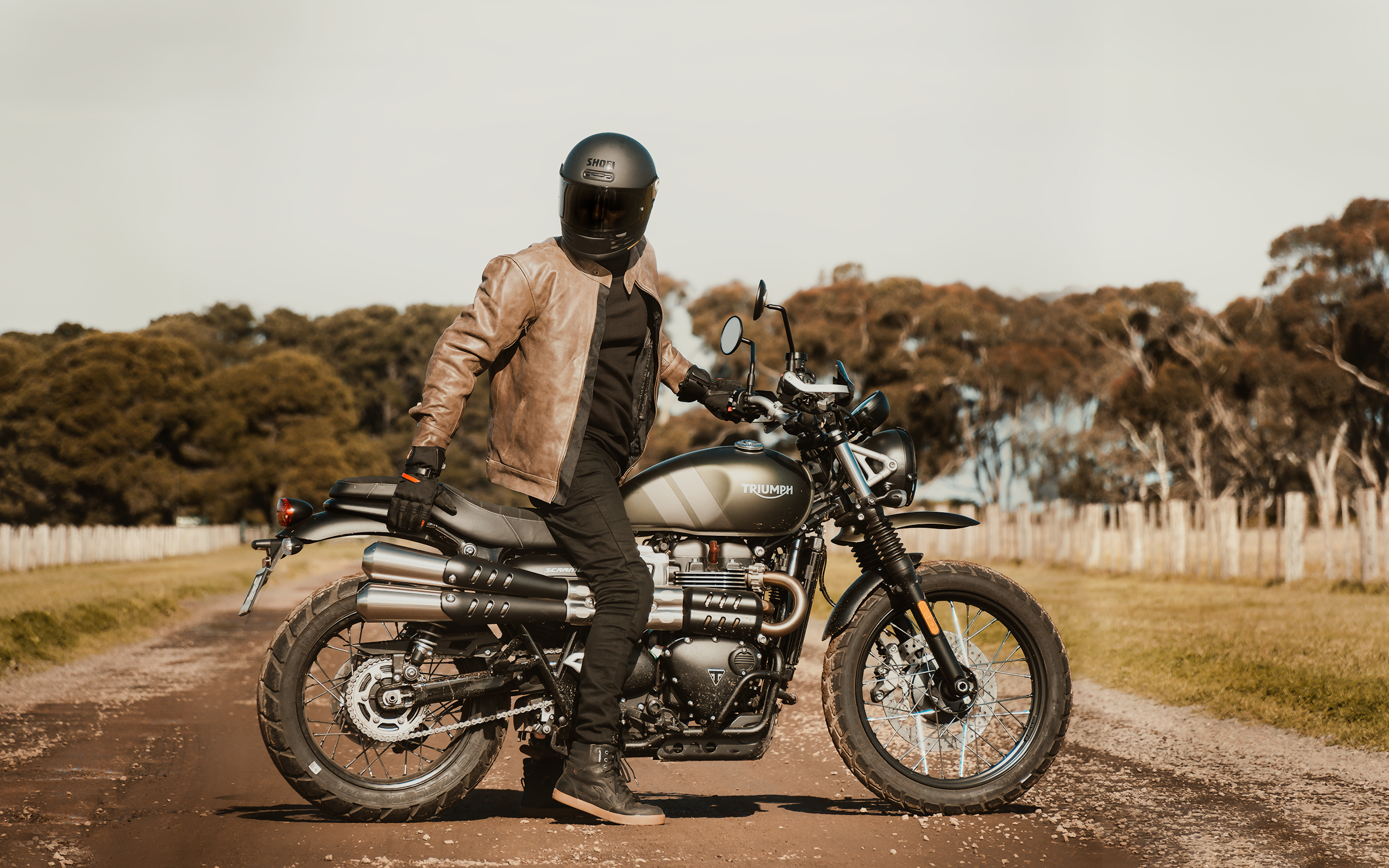 Man on motorcycle wearing Black Pup Moto Nelson Leather Jacket