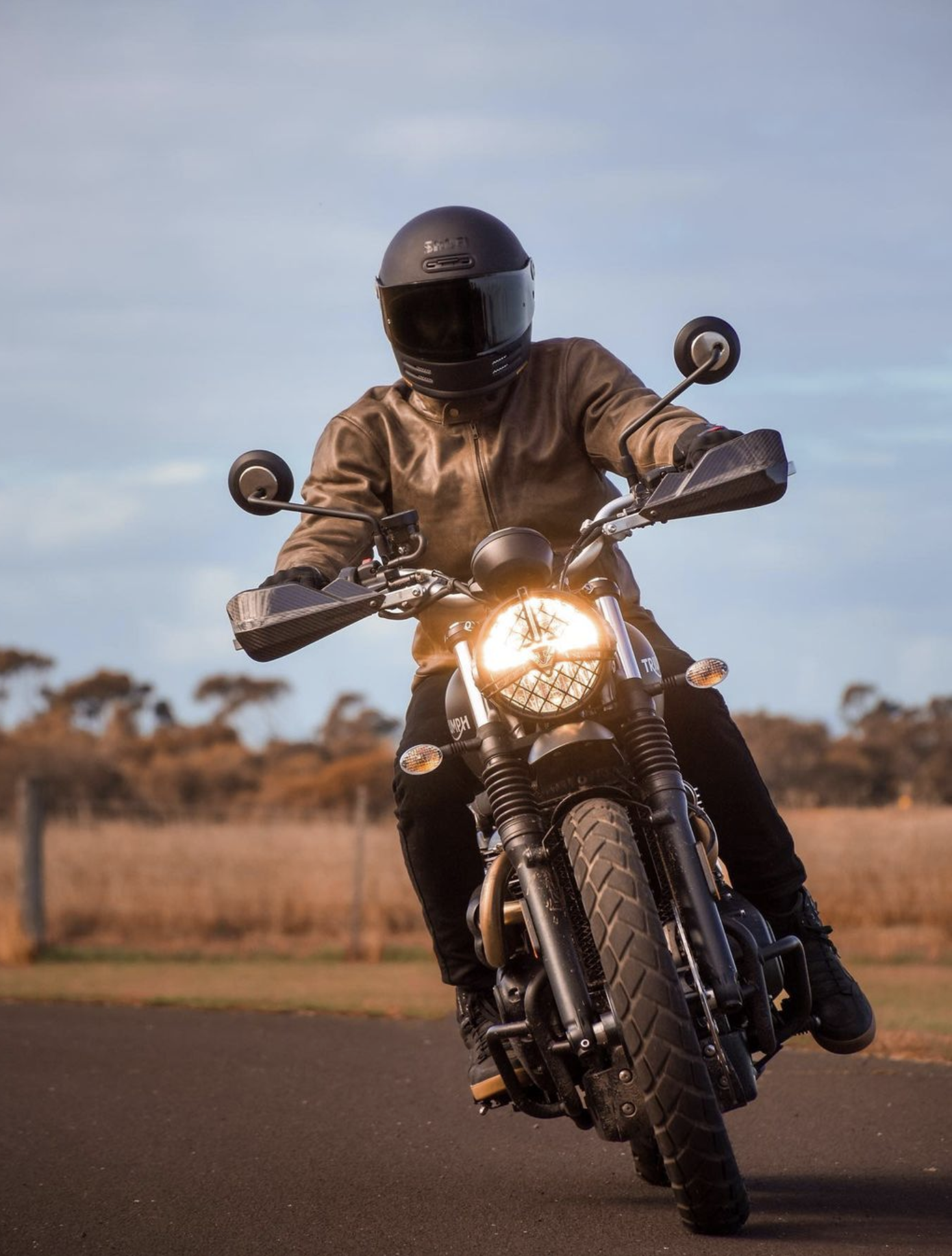 Front view of man riding motorcycle