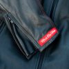 Black Pup Moto's new Rumbler Jacket on a rider - detail shot of label