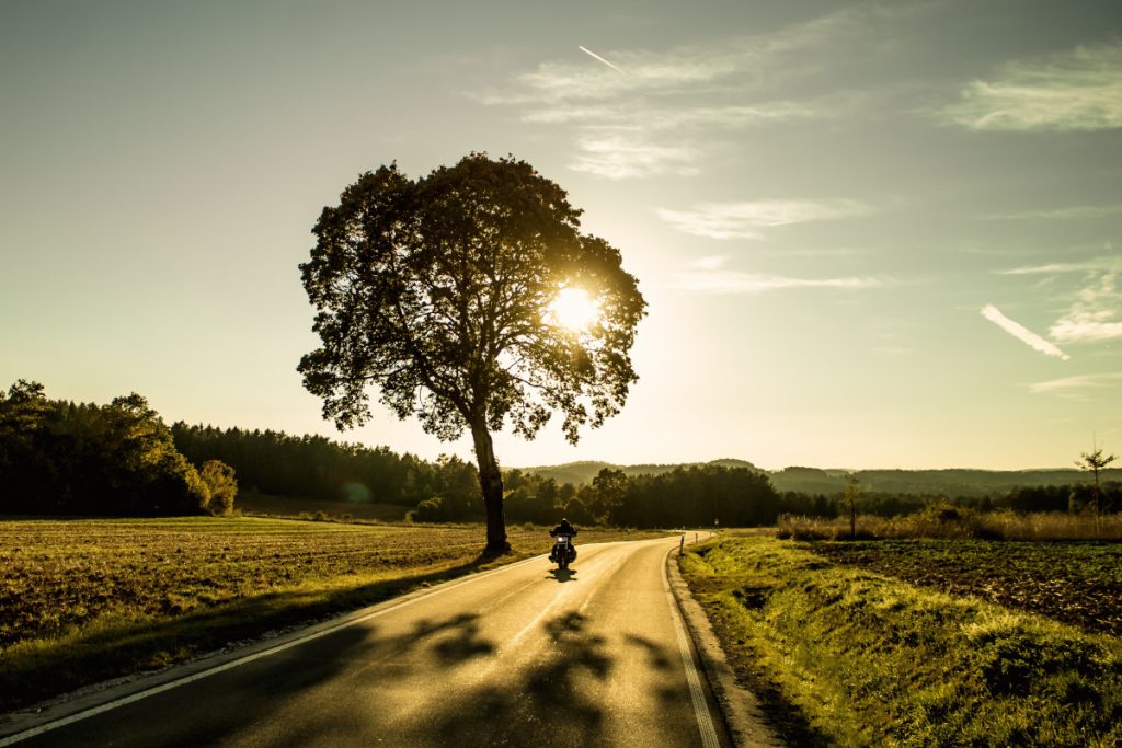 Motorcycle against a sunset in countryside