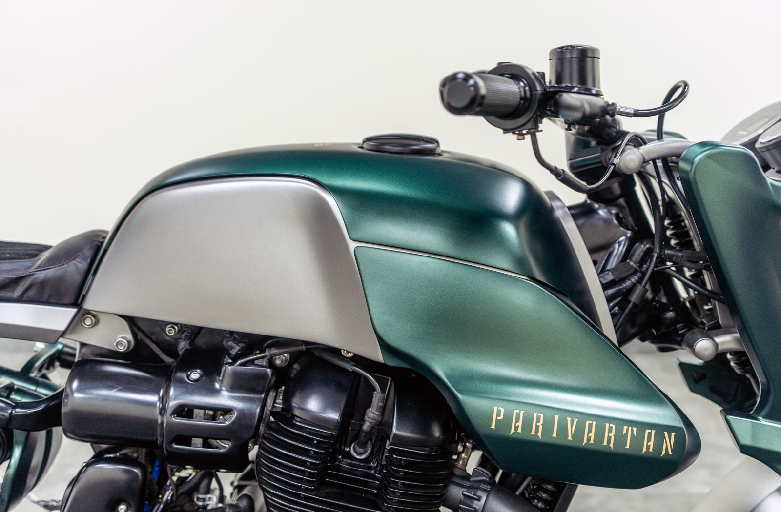 side photograph of a custom Royal Enfield Shotgun 650 fuel tank
